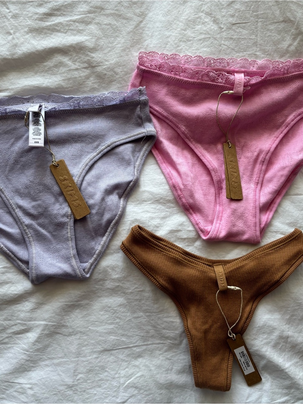 SKIMS Pink + Lavender Logo Pointelle Bikinis & Brown Ribbed Thong